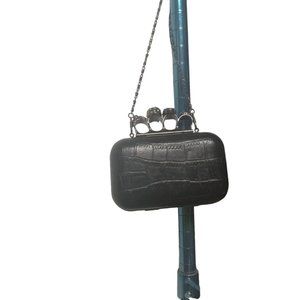 Brass knuckle clutch skull purse.